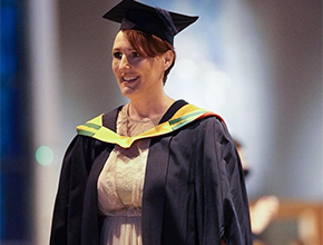 Graduate walking across the stage